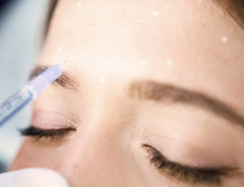 a person getting botox injection